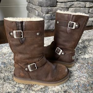 UGG brown leather tall boots . Side buckles . Size 6. Womens . Great condition